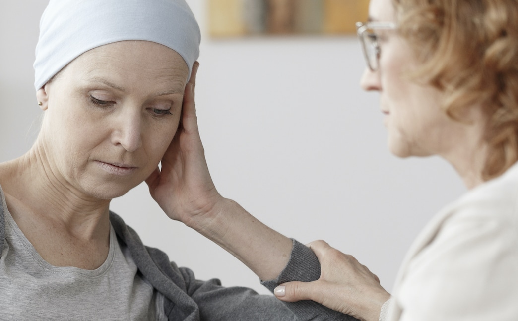 Woman Talking to Hospice Patient